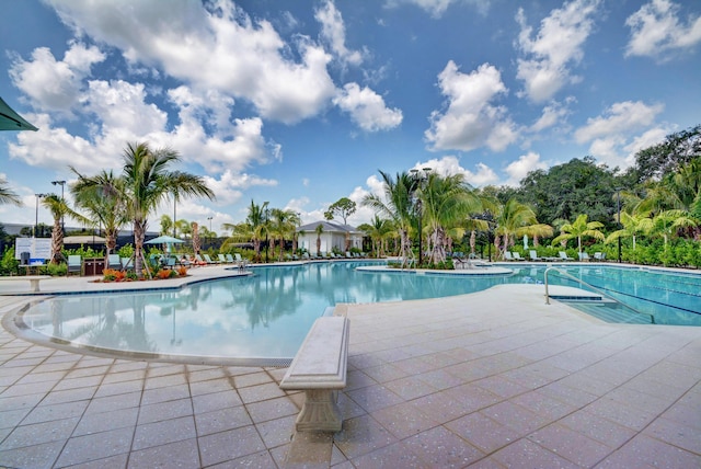 community pool with a patio area