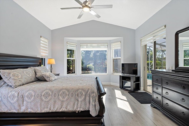 bedroom featuring baseboards, ceiling fan, vaulted ceiling, wood finished floors, and access to outside