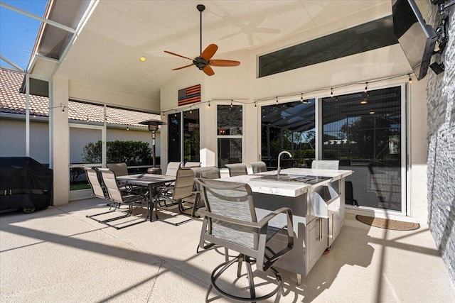 view of patio / terrace with outdoor dining area, grilling area, and ceiling fan