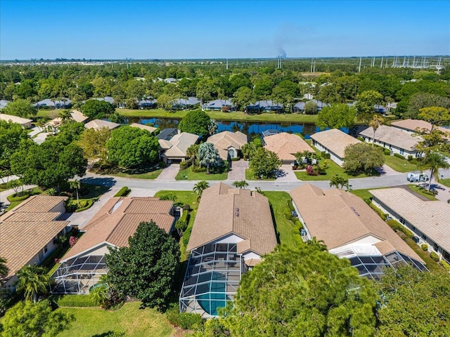 birds eye view of property featuring a residential view and a water view