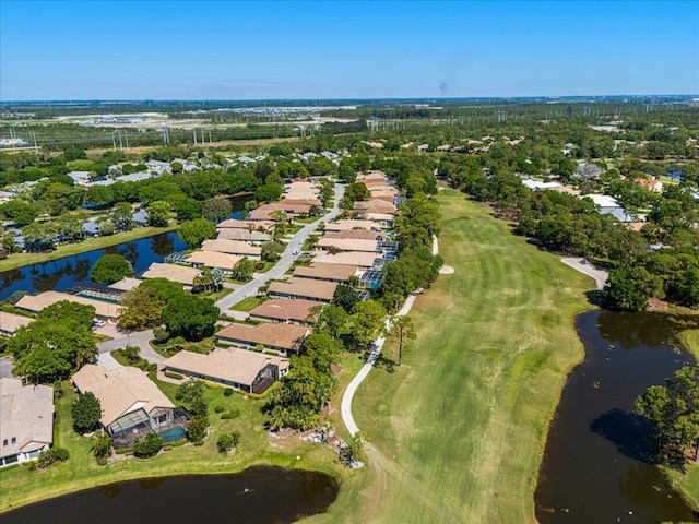 drone / aerial view featuring a water view and a residential view