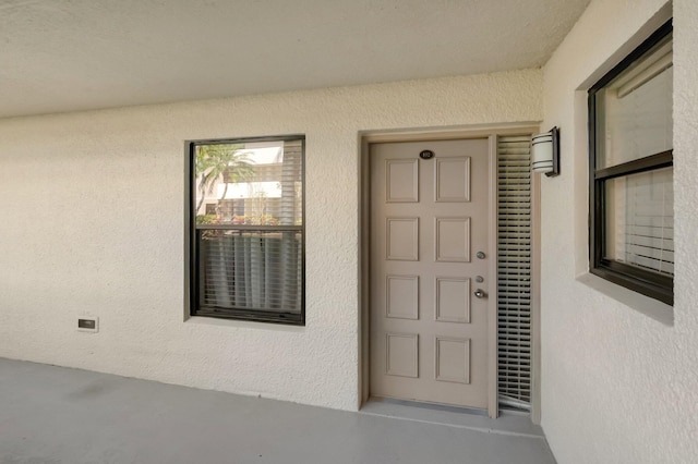 5801 Camino Del Sol Unit 102, Boca Raton, FL 33433 - view of exterior entry with stucco siding