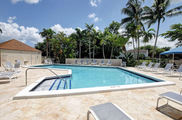 5801 Camino Del Sol Unit 102, Boca Raton, FL 33433 - community pool featuring a patio area and fence