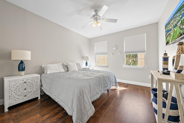 bedroom featuring baseboards, wood-type flooring, and ceiling fan