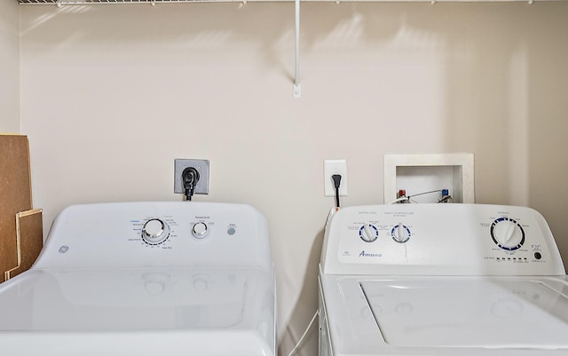 clothes washing area with laundry area and separate washer and dryer