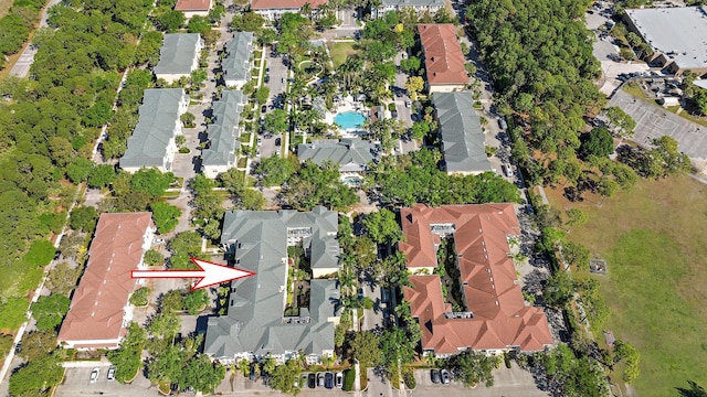 birds eye view of property with a residential view