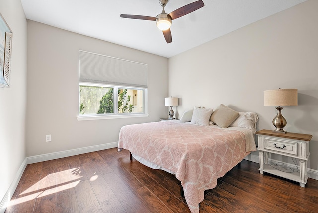 bedroom with baseboards, dark wood finished floors, and a ceiling fan