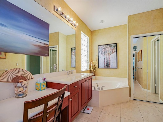 full bath featuring a bath, vanity, and tile patterned flooring