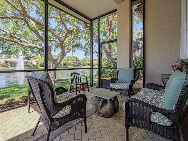 sunroom with a water view