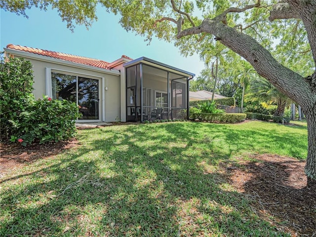 view of yard featuring a sunroom