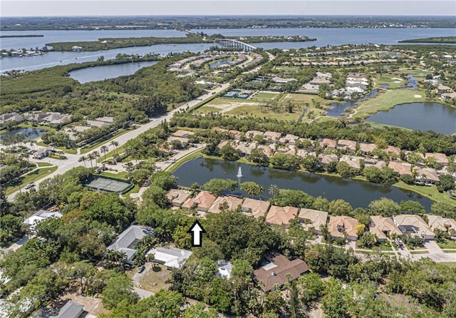 drone / aerial view featuring a residential view and a water view