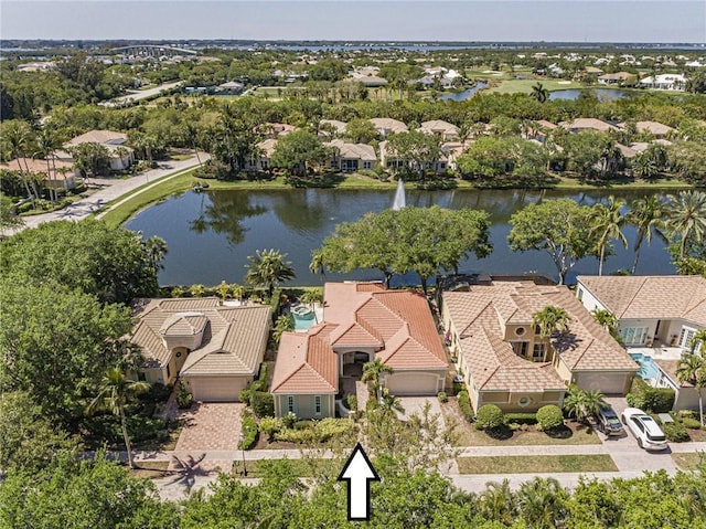 bird's eye view with a residential view and a water view