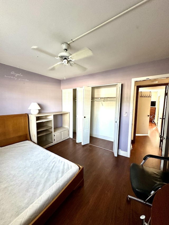 bedroom with baseboards, ceiling fan, and wood finished floors