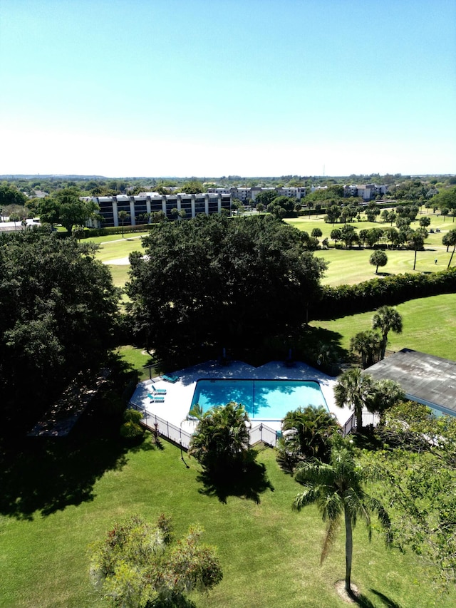 view of pool featuring a yard, a fenced in pool, and fence