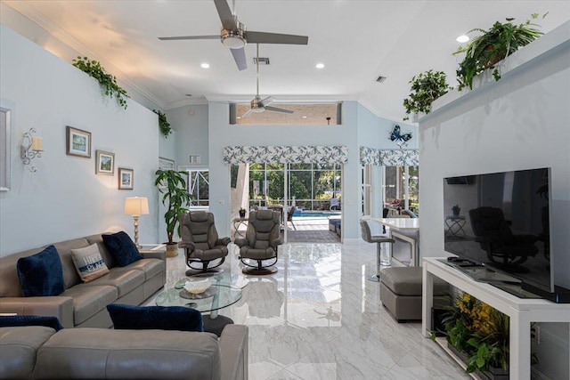 living area with ceiling fan, ornamental molding, recessed lighting, a sunroom, and marble finish floor