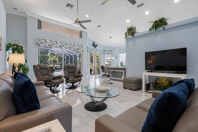 living room with a sunroom, a ceiling fan, visible vents, and marble finish floor