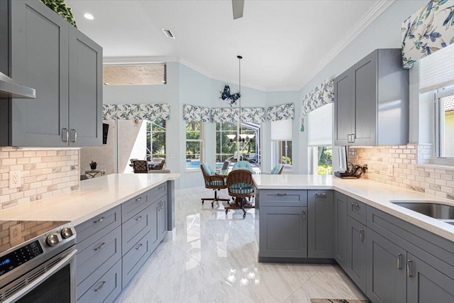 kitchen with gray cabinets, stainless steel range with electric cooktop, and ornamental molding