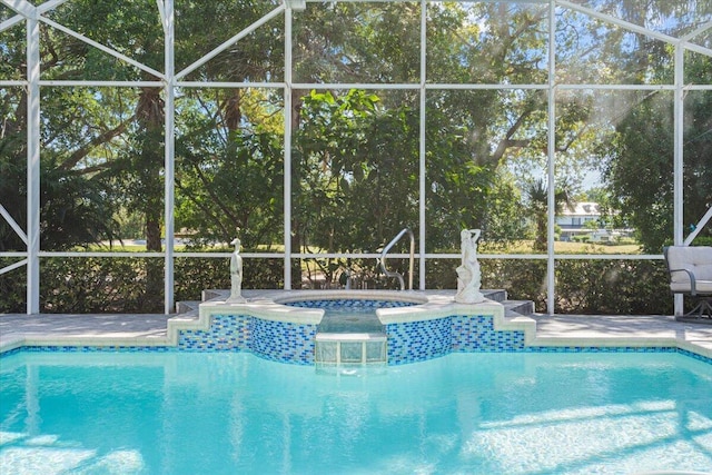 outdoor pool with an in ground hot tub and a lanai