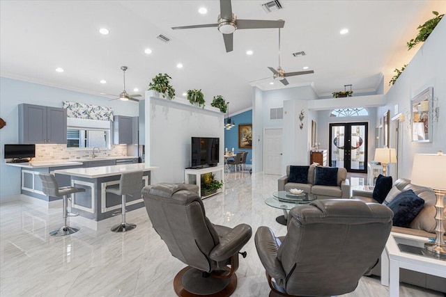 living room with visible vents, marble finish floor, and french doors