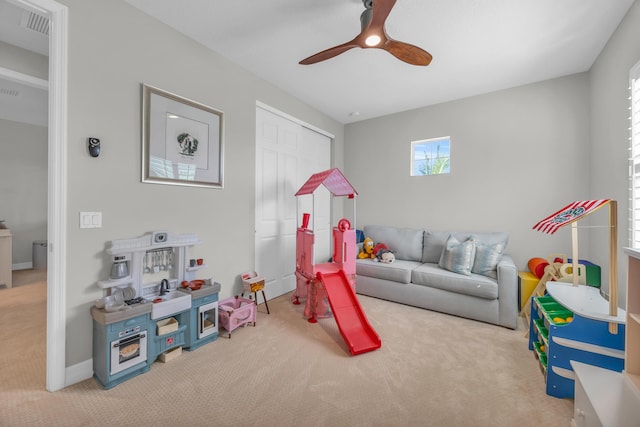 game room with carpet flooring, baseboards, and a ceiling fan