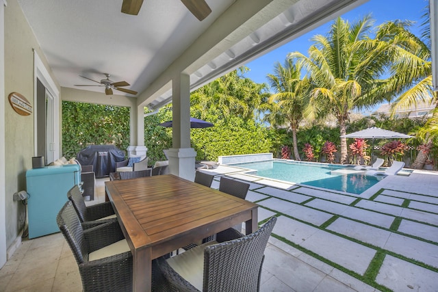 view of patio featuring an outdoor pool, outdoor dining area, area for grilling, and ceiling fan