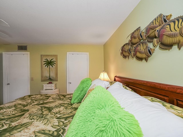 bedroom featuring visible vents