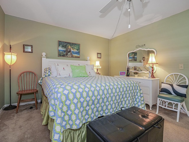 bedroom featuring baseboards, a ceiling fan, carpet flooring, and vaulted ceiling