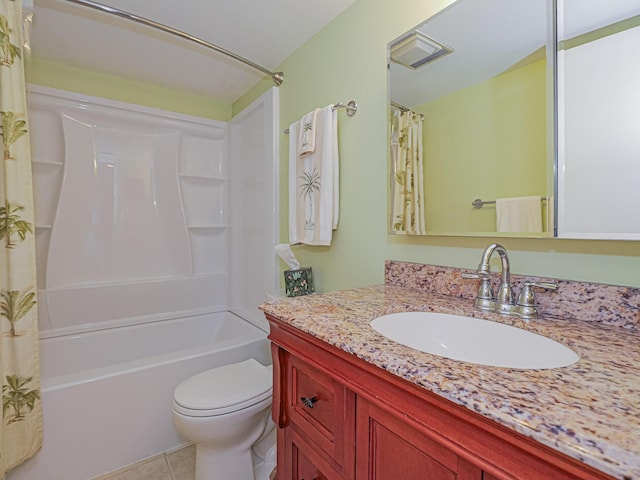 full bath with tile patterned floors, shower / tub combo, toilet, and vanity