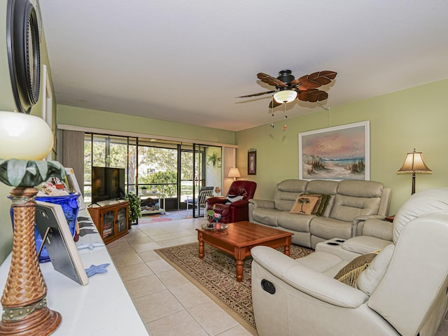 living area featuring light tile patterned floors and ceiling fan