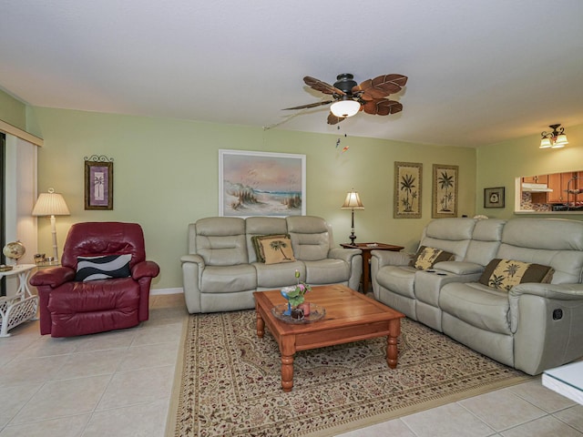 living area featuring light tile patterned flooring and ceiling fan