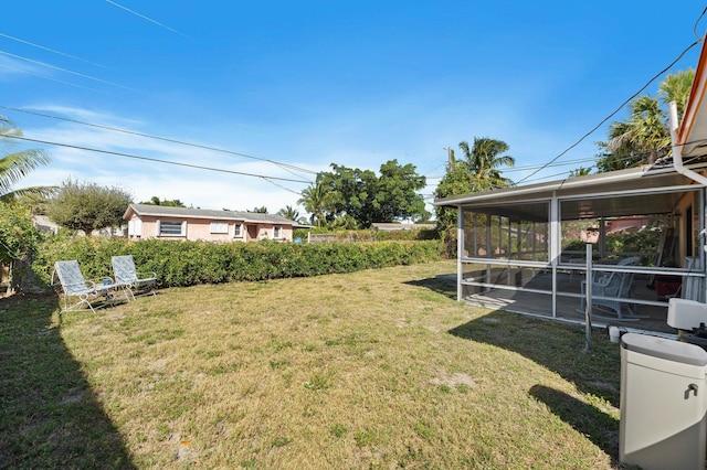 view of yard featuring a sunroom