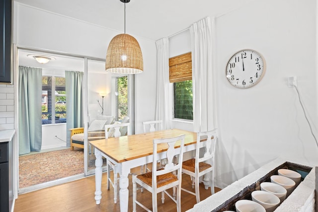 dining area with light wood finished floors