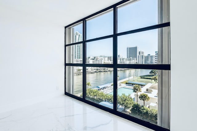 room details featuring a view of city and a water view