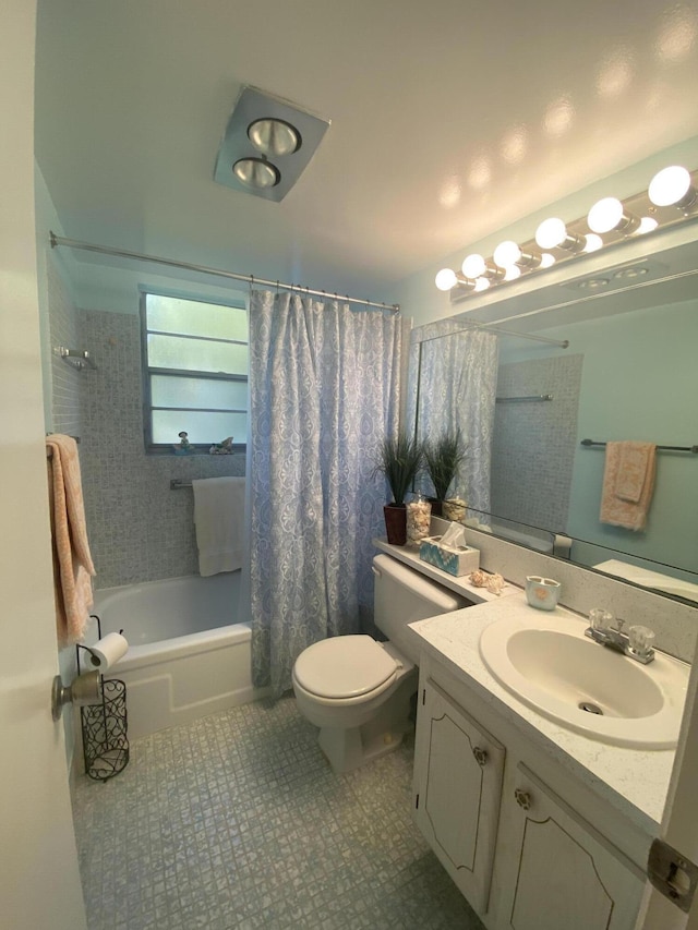 full bathroom with tile patterned flooring, toilet, vanity, and shower / bath combo