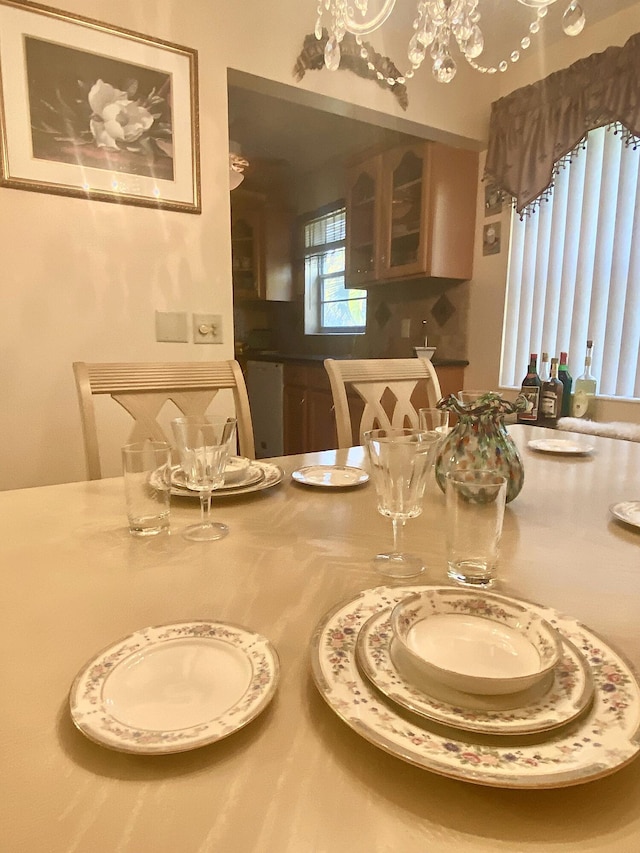 dining space featuring a notable chandelier