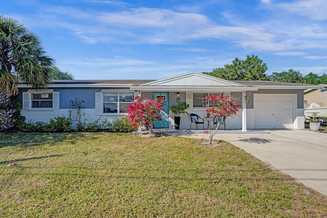 ranch-style home with brick siding, driveway, a front yard, and a garage