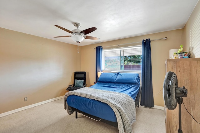 bedroom featuring baseboards and a ceiling fan