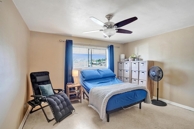 bedroom featuring baseboards and a ceiling fan