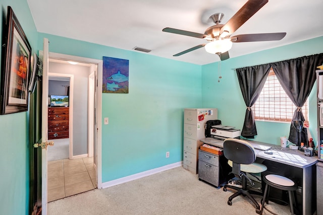 office featuring visible vents, baseboards, light colored carpet, and ceiling fan