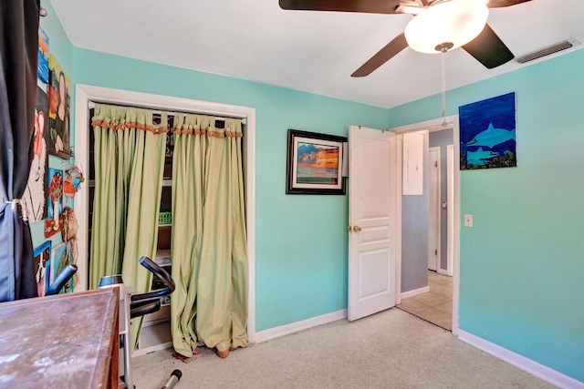 carpeted bedroom with baseboards, visible vents, a closet, and ceiling fan