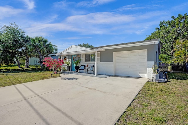 single story home featuring fence, driveway, an attached garage, a front lawn, and brick siding