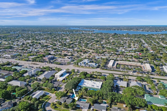 birds eye view of property with a water view and a residential view