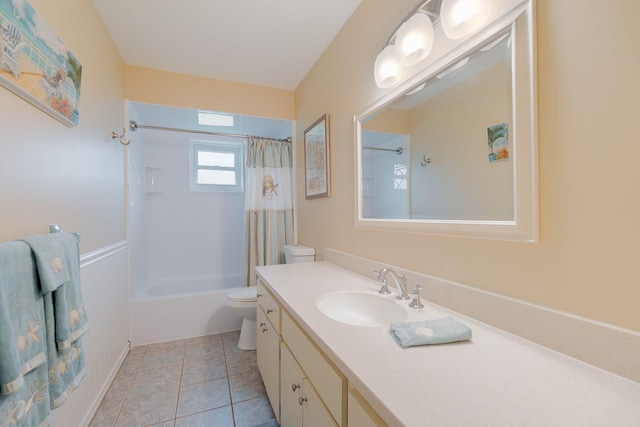 bathroom featuring vanity, toilet, shower / bath combo, and tile patterned flooring