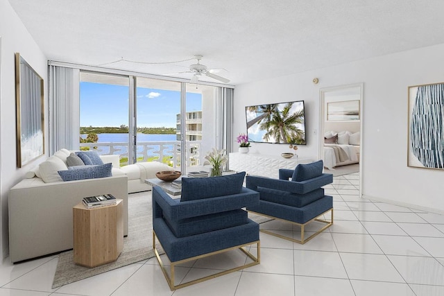 2760 S Ocean Blvd Unit 416, Palm Beach, FL 33480 - living room with a ceiling fan, light tile patterned flooring, and a wall of windows