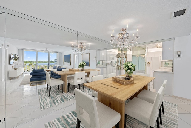 2760 S Ocean Blvd Unit 416, Palm Beach, FL 33480 - dining space with a chandelier and light tile patterned floors