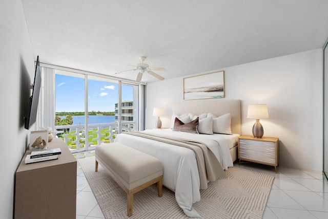 2760 S Ocean Blvd Unit 416, Palm Beach, FL 33480 - bedroom with expansive windows, light tile patterned floors, access to exterior, and ceiling fan