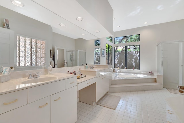 bathroom with vanity, recessed lighting, tile patterned flooring, a shower stall, and a garden tub