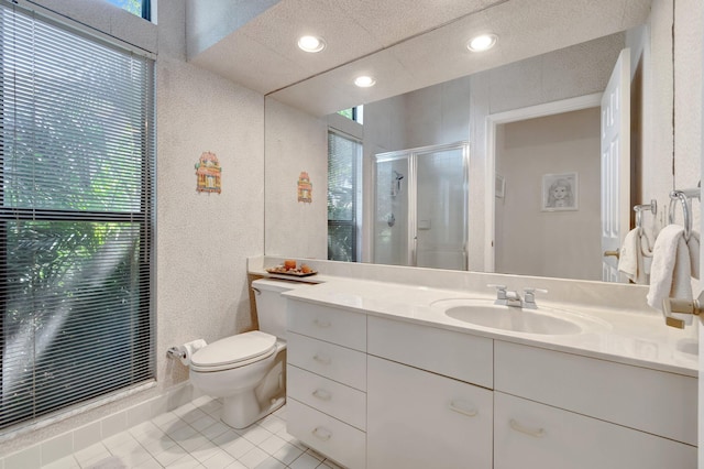 full bath with tile patterned floors, a healthy amount of sunlight, toilet, and a shower stall