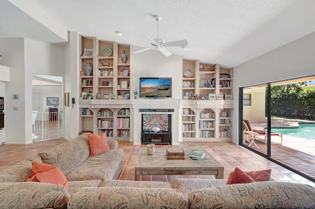 tiled living area featuring built in features, a textured ceiling, ceiling fan, and vaulted ceiling