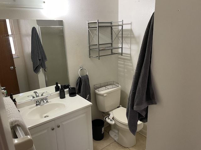 full bathroom featuring an enclosed shower, toilet, vanity, and tile patterned flooring